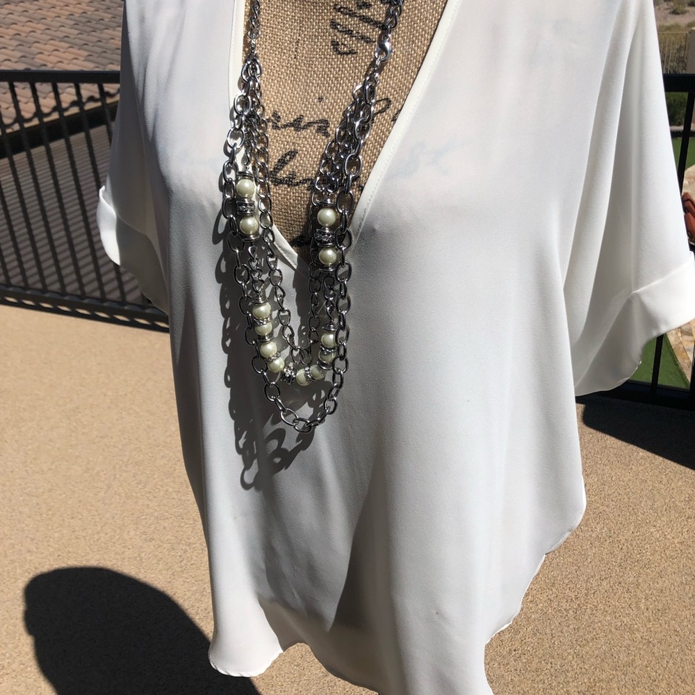 White breezy top.